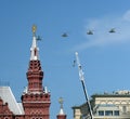 Shock-and-combat helicopters Mi-24P during the parade fly in the sky over Red Square.